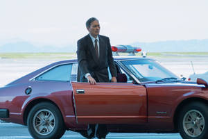 Ken Watanabe With Nissan Fairlady Z From Tokyo Vice Wallpaper