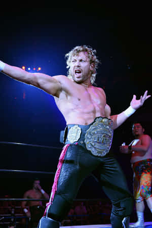 Kenny Omega Holding The Iwgp Heavyweight Championship Belt Wallpaper