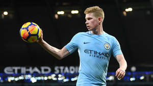 Kevin De Bruyne Holding Soccer Ball Wallpaper