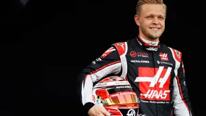 Kevin Magnussen Holding His Helmet In Confidence Wallpaper