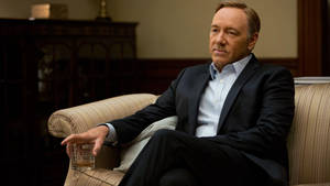 Kevin Spacey Cross Legs Wallpaper