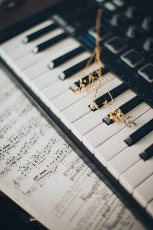 Keyboard With Sheet Music 4k Wallpaper