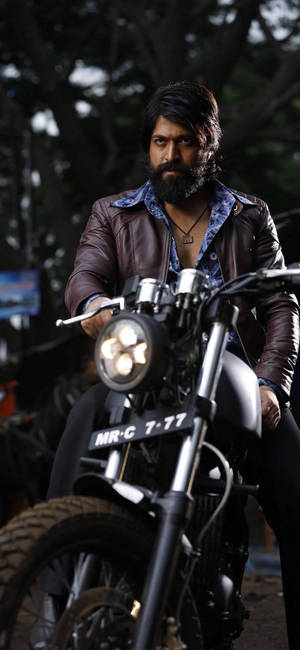 Kgf Yash Riding On A Bike Wallpaper