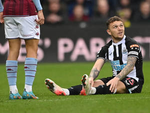 Kieran Trippier Sitting On Ground Wallpaper