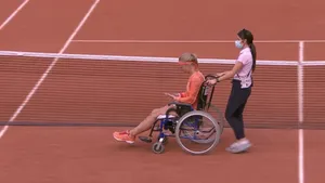 Kiki Bertens In A Wheelchair At A Tennis Tournament Wallpaper