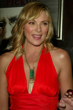 Kim Cattrall Glows In Vibrant Orange Dress Wallpaper