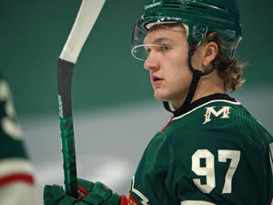 Kirill Kaprizov Nhl Star's Powerful Shot Wallpaper