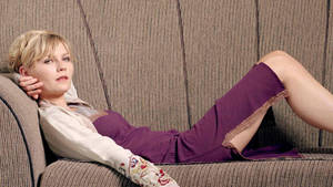 Kirsten Dunst On Couch Wallpaper