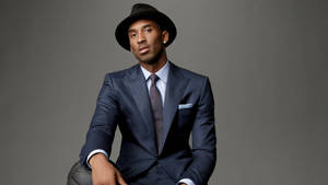 Kobe Bryant Is All Smiles In A Suit Wallpaper