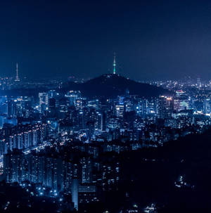 Korean Nighttime Skyline - A Symphony Of Lights Wallpaper