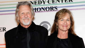 Kris_ Kristofferson_at_ Event_with_ Companion Wallpaper