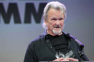 Kris Kristofferson Speakingat Event Wallpaper