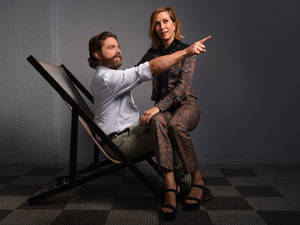 Kristen Wiig On Actors Lap Wallpaper