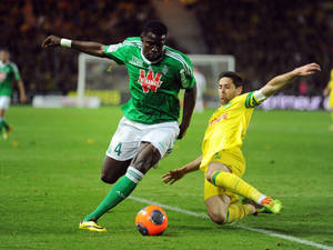 Kurt Zouma Kicking Orange Ball Wallpaper