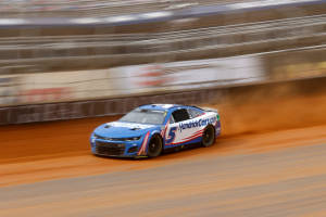 Kyle Larson Speeding Down Dirt Track Wallpaper