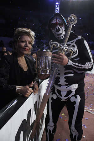 La Parka Wrestlerwith Championship Beltand Fan Wallpaper