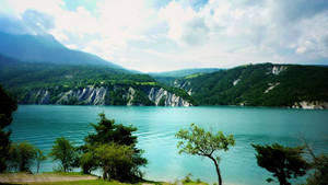 Lake View With Turquoise Water Wallpaper