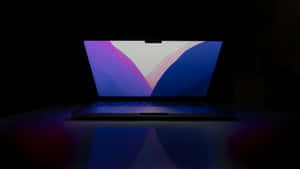 Laptop Illuminatedin Darkness Wallpaper