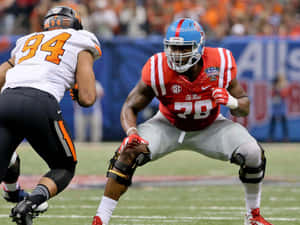 Laremy Tunsil Defense Bending Stance Wallpaper