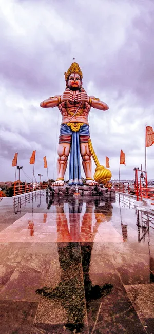 Large And Colorful God Hanuman Statue Wallpaper