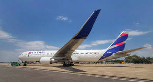 Latam Airlines Plane Parked In The Airport Wallpaper