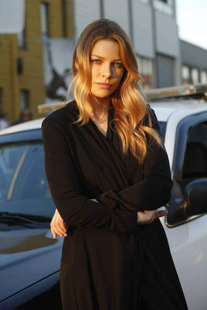 Lauren German Leaning On A Car Wallpaper