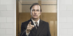 Lawyer Jimmy Mcgill Peering In The Mirror In Better Call Saul Wallpaper