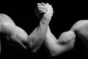 Leave It All On The Line In Arm Wrestling Wallpaper