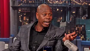 Legendary Comedian Dave Chappelle Performing Stand-up Wallpaper