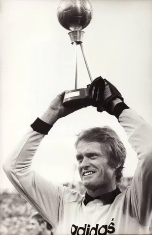 Legendary German Goalkeeper Sepp Maier Holding A Football Trophy. Wallpaper