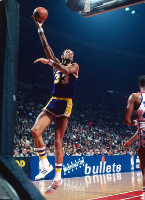 Legendary Kareem Abdul-jabbar Posing With Adidas Sneakers. Wallpaper