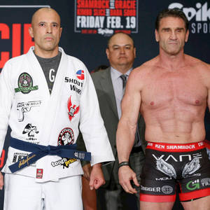 Legendary Mma Stars Ken Shamrock And Royce Gracie Striking A Pose Wallpaper