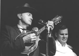 Legendary Musician Bill Monroe Performing At 1963 Newport Folk Festival Wallpaper