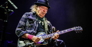 Legendary Musician Neil Young Performing At Festival D'ete De Quebec Wallpaper