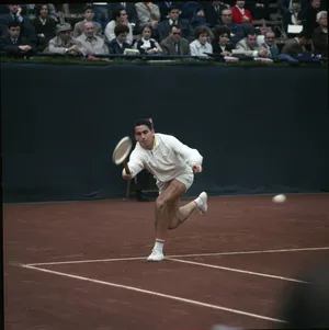 Legendary Tennis Champion Manuel Santana In Action Wallpaper