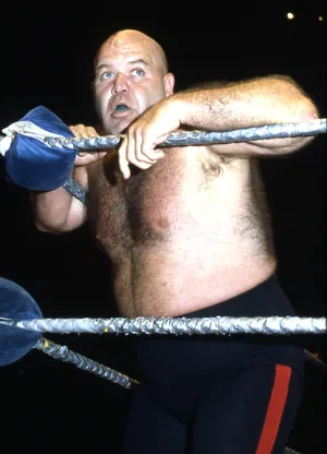 Legendary Wrestler George Steele Leaning On Wrestling Ring Wallpaper