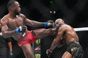 Leon Edwards Kicking Kamaru Usman Wallpaper