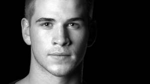 Liam Hemsworth On Black Background Wallpaper