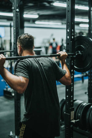 Lifting Weights In The Gym Wallpaper