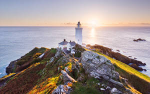 Lighthouse Overseeing Horizon Wallpaper