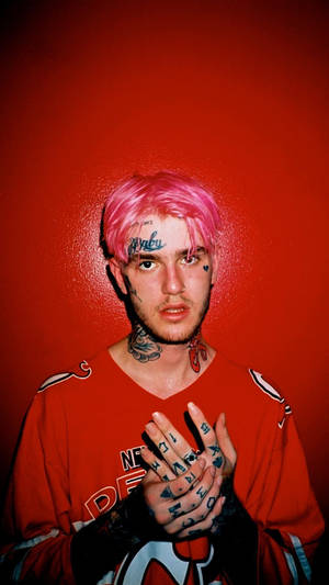 Lil Peep Wearing A Striking Red Ensemble Wallpaper