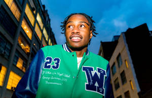 Lil Tjay In Varsity Jacket Wallpaper