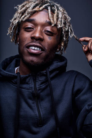 Lil Uzi Vert Looking Chill In A Black Hoodie Wallpaper