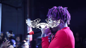 Lil Uzi Vert Putting On An Electrifying Show In Front Of A Hyped-up Crowd Wallpaper