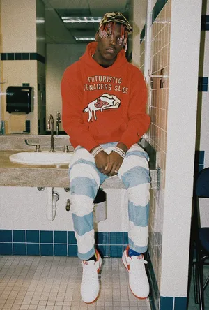 Lil Yachty Wearing His Iconic Red Braids. Wallpaper