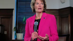 Lisa Murkowski Holding A Microphone Wallpaper