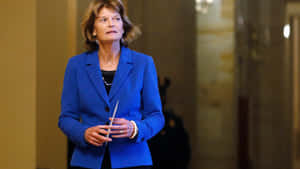 Lisa Murkowski Walking Blue Dress Wallpaper