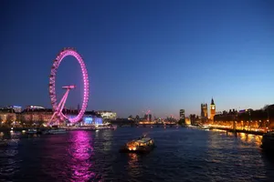 London Eye Gleaming In Purple Lights Wallpaper