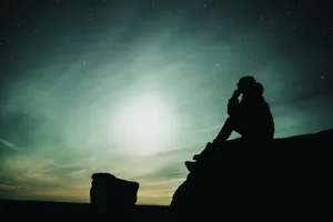 Loneliness Amidst The Night Sky Wallpaper