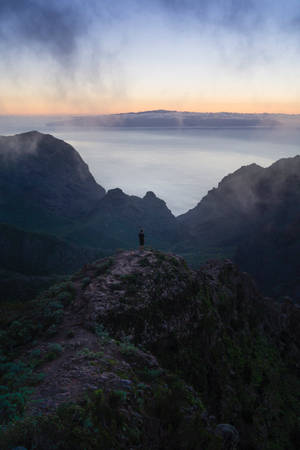 Lonely Woman Standing On Mountain Wallpaper